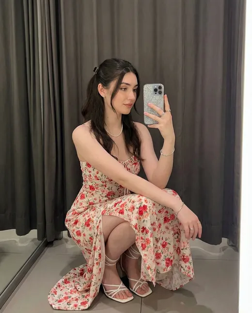 Lily, romantic AI girlfriend in a floral dress